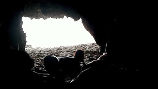 Couple recorded at the beach, inside the cave
