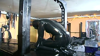 Extreme bondage for latex fetish slut
