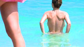 Smoothest nudist play in the warm water  at a nudist beach