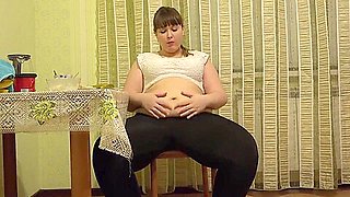 Sexy bbw eats in the kitchen and strokes fat belly. Fetish.