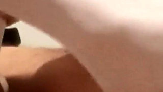 MILF in Pantyhose and Heels Gives a Footjob