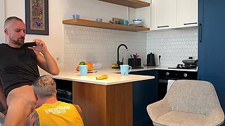 Hot wife is clueless talking to her friend while her husband sucks his cock under the table