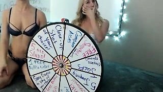 In a kitchen a sexy brunette playing with her big boobs