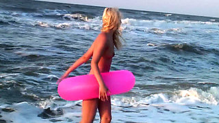 Hot naked blonde on the beach