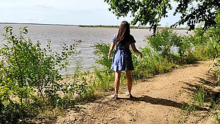 I Lift up My Dress and Show My Butt on the Riverbank