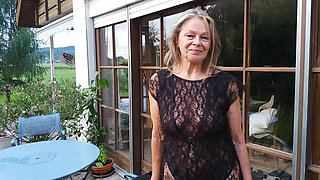 A Mature Woman Shows off Her Figure Outside in a Lace Bodysuit!