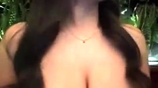 Brunette seductress working her big boobs and hot ass