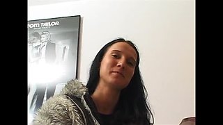 Brunette slut fingers her wet pussy on casting couch