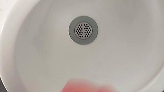 Moaning daddy has a lot of pressure and milks his cock in the public toilet