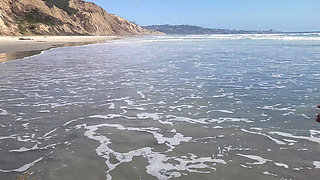 Playing at the nude beach.