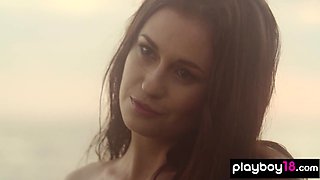 Adorable skinny muse posing on the rocks