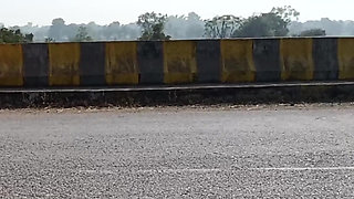 Sister-in-law is walking on the bridge by the roadside, getting down on the shore, sister-in-law started taking her clothes from the toilet and fingering her pussy.