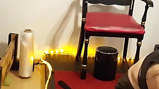 Curvy Brunette Dominatrix Commands Bound Slave in Fetish Dungeon